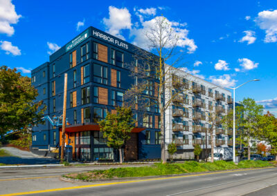 5 story multifamily building with blue exterior.