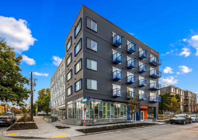 Exterior view of The Keystone at 9201 Delridge, showing modern architecture.