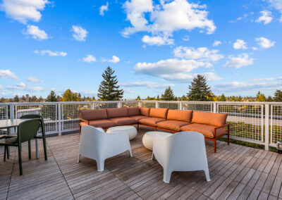 Rooftop deck at The Keystone, 9201 Delridge, with patio seating and city views.