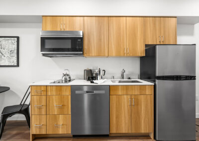 Modern kitchen at The Keystone, 9201 Delridge, with stainless appliances.