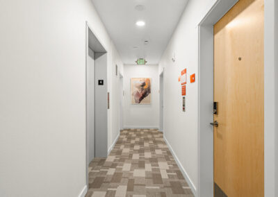 Interior hallway of The Keystone, 9201 Delridge, with geometric carpet.
