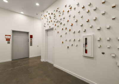 Interior space at The Keystone, 9201 Delridge, with mailboxes and art installation.